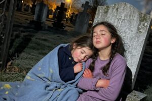 Orphan Girl Protects Lost Child in a Cemetery All Night — What the Father Did Next Stunned Everyone
